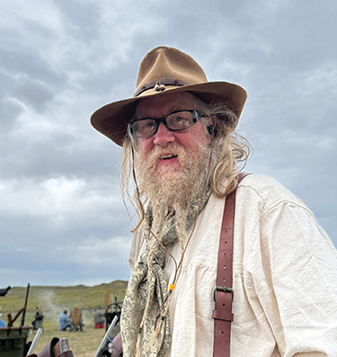 Here’s Mark behind the firing line. Look at those gray clouds!